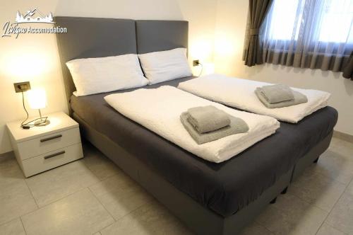 Ein Bett oder Betten in einem Zimmer der Unterkunft Eco House la tua scelta consapevole stilosa