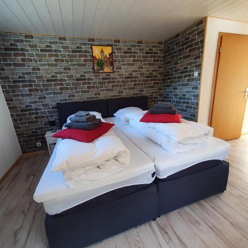 Postel nebo postele na pokoji v ubytování B&B Waldcafe