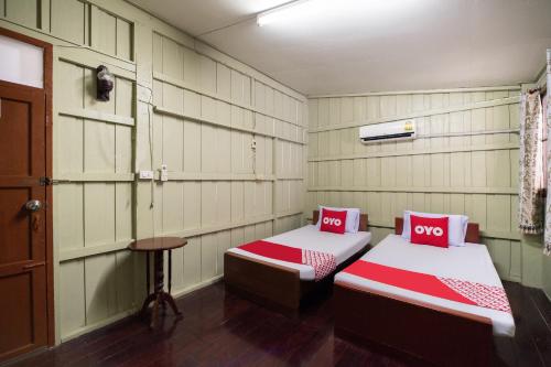 Ліжко або ліжка в номері OYO 691 Don Muang Boutique House