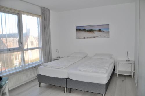 Ένα ή περισσότερα κρεβάτια σε δωμάτιο στο Petten Beach 10