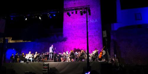 a group of people on a stage with a orchestra at Casa da Avó Bé in Portalegre