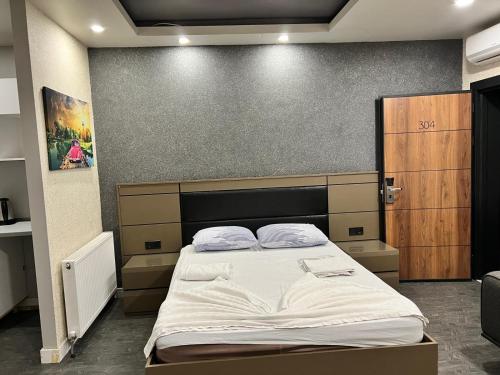 a bedroom with a large bed in a room at Kent Suit Otel in Istanbul