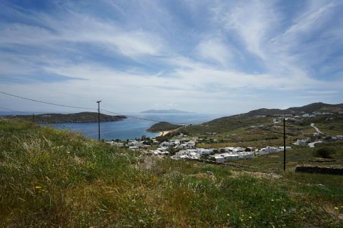 a view of a town and a body of water at Serifos cozy home with a view in Livadakia