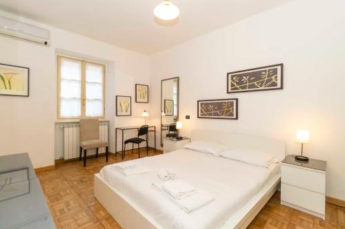 Posteľ alebo postele v izbe v ubytovaní Piazza Vittorio Veneto Central Apartment