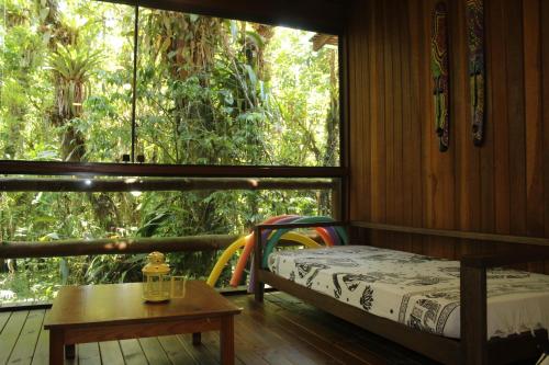 Giường trong phòng chung tại Maresias Beach House - Casas de alugueis em cond beira mar