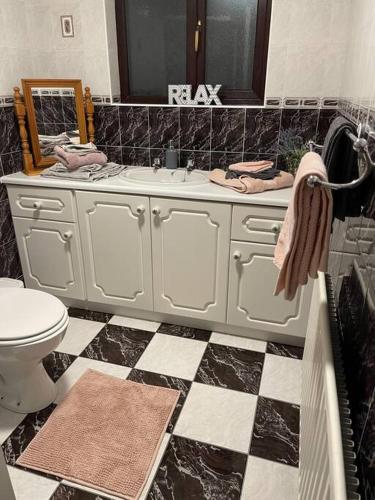 a bathroom with a sink and a toilet at Grogagh Hill Cottage in Sligo