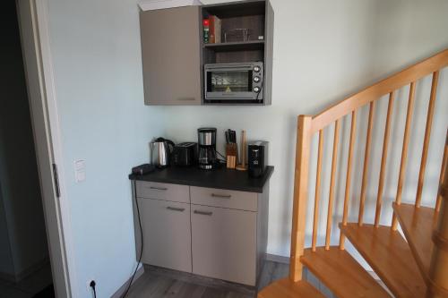 Η κουζίνα ή μικρή κουζίνα στο Penthouse am Großen Plöner See