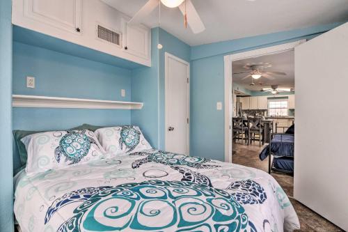 Una cama o camas en una habitación de 1 Block to Surfside Beach Home with Deck!