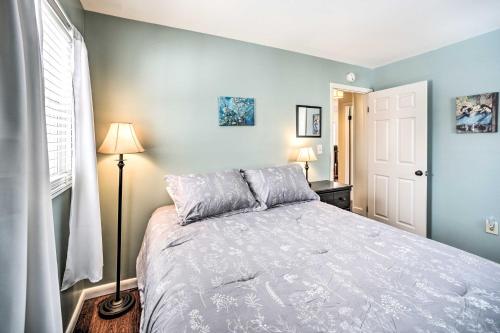 a bedroom with a large bed with blue walls at Updated Home in the Heart of Saratoga Springs in Saratoga Springs