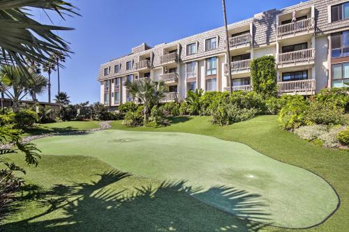 a golf course in front of a building at Charming Oceanside Condo with Beach and Pool Access! in Oceanside