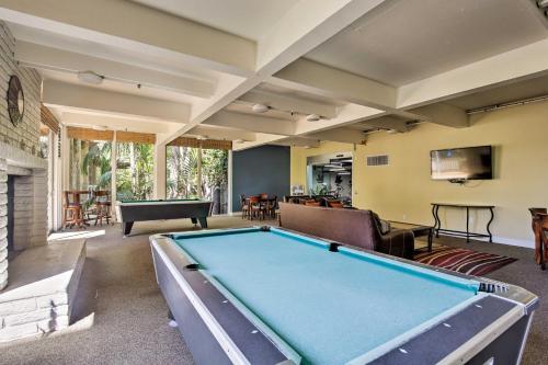 a large living room with a pool table at Charming Oceanside Condo with Beach and Pool Access! in Oceanside