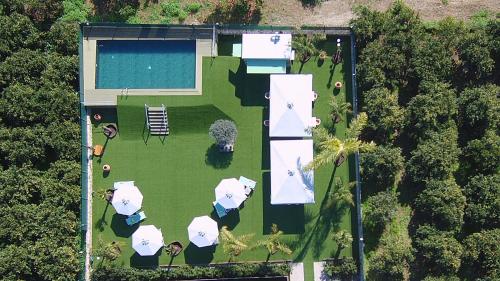 an aerial view of a yard with a pool at Desa Green Homes in Ancient Epidavros