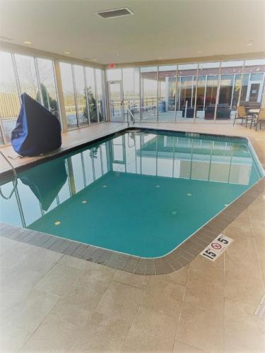 a large swimming pool in a building at Wyndham Avon in Avon Center