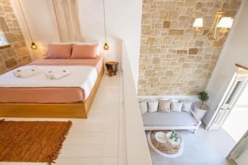 two pictures of a bedroom with a bed and a chair at Grannys Villas finiki in Karpathos Town