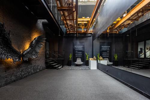 an empty hallway with an eagle on the wall at Black Hotels Köln in Cologne