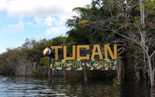 a sign in the middle of a body of water at Amazônia LODGE Exxperience in Manaus