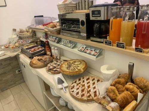 a bakery with many different types of bread and pastries at Domus Terenzio in Rome