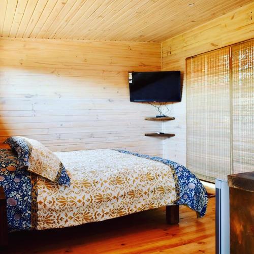 Ένα ή περισσότερα κρεβάτια σε δωμάτιο στο Casa babilon Pichilemu