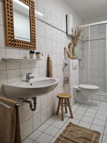 a bathroom with a sink and a toilet at Watt will man Meer in Cuxhaven