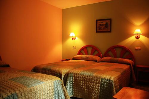 Postel nebo postele na pokoji v ubytování Hostal Casa Lacreu