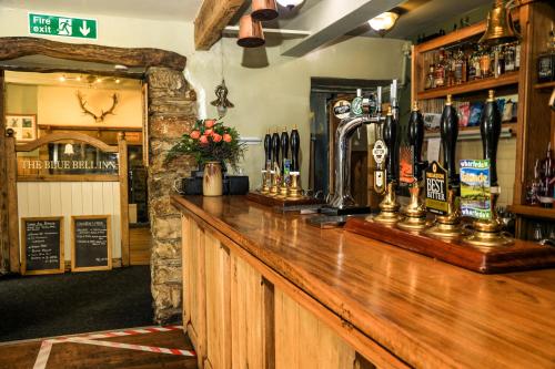 a bar with a wooden counter in a pub at The Blue Bell Inn in Kettlewell