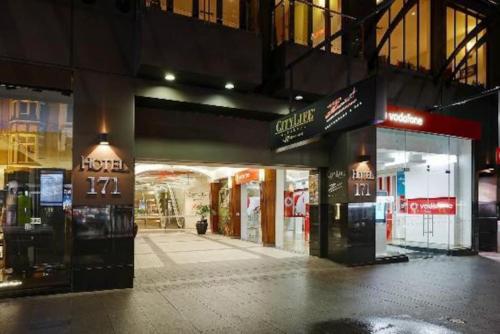 an empty shopping mall at night with a store at Central Cute Studio with Kitchenette - Free WiFi in Auckland