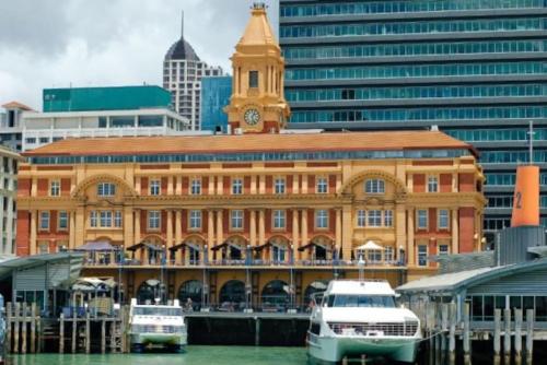 a large building with a clock tower on top of it at Central Cute Studio with Kitchenette - Free WiFi in Auckland