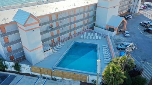 an overhead view of a building with a swimming pool at The Reef At Seahaven Beach Resorts in Panama City Beach