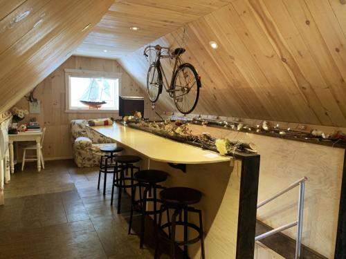 a bike hanging on the wall of a room at Appartement champêtre in Saguenay