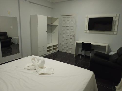 Кровать или кровати в номере Topazzo Hotel