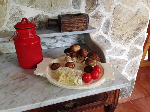a plate of food on a table next to a red thermos at Gasthaus Maria in Borlova