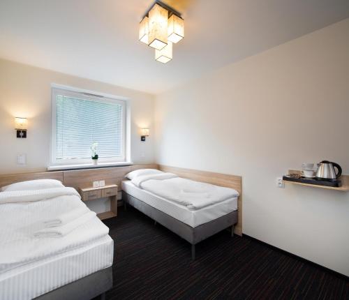 Automobil Hotelにあるベッド