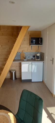 a room with a kitchen with a counter top at Demeure de la Garenne in Montmirail