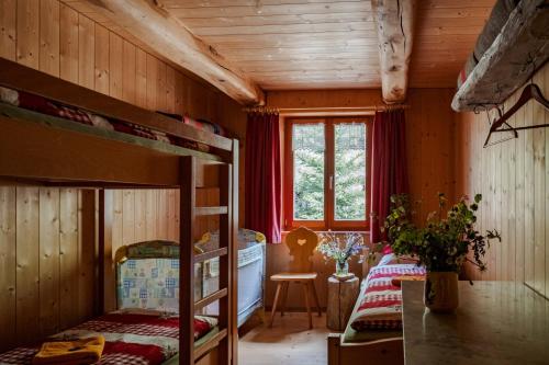 Postel nebo postele na pokoji v ubytování Rifugio Alpe San Romerio