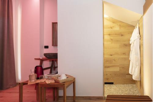 a living room with a table and a staircase at Agriturismo Pisani in Brez