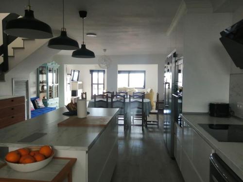 a kitchen with a bowl of oranges on a counter at Morro Mar in Morro del Jable