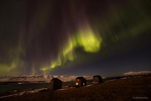 an image of the northern lights in the sky at Sunnuhlid houses in Akureyri