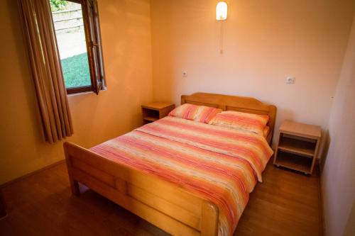 Postel nebo postele na pokoji v ubytování Apartmani Vidra