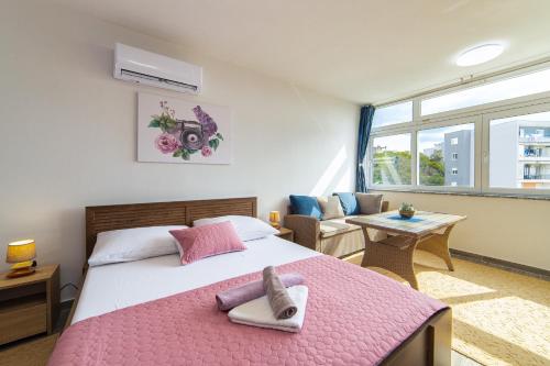 Postel nebo postele na pokoji v ubytování Apartment Sunrise Ploče