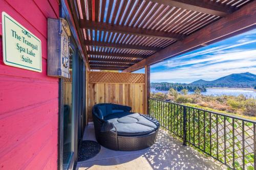 a patio with a bean bag chair on a balcony at Quiet Mind Mountain Lodge, Retreat & Spa in Julian