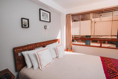 Ένα ή περισσότερα κρεβάτια σε δωμάτιο στο Dreams House Cusco