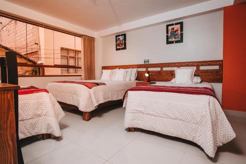 Ένα ή περισσότερα κρεβάτια σε δωμάτιο στο Dreams House Cusco