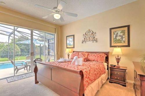 ein Schlafzimmer mit einem Bett und einem großen Fenster in der Unterkunft Triton Vacation Pool Home Near Disney in Orlando