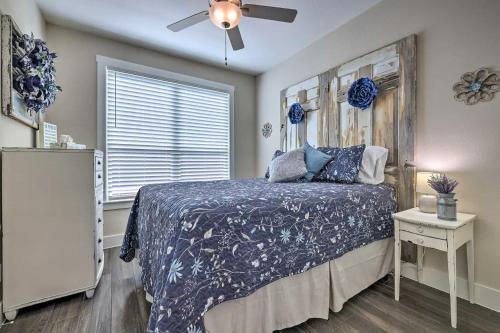 a bedroom with a bed and a ceiling fan at Convenient Cute Cottage Hot Tub Fire Pit Sleeps 6 in Canyon Lake