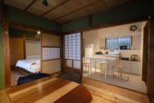 a room with a kitchen and a table in a room at Ichiya - Vacation STAY 83331 in Shimosato