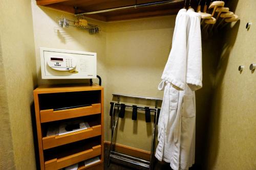 a kitchen with a towel hanging on a wall at South Pacific Hotel in Hong Kong