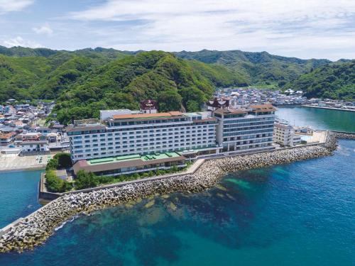 an aerial view of a hotel on the water at Mikazuki Sea-Park Hotel Awa Kamogawa in Kamogawa