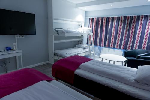 Postel nebo postele na pokoji v ubytování Quality Hotel Maritim