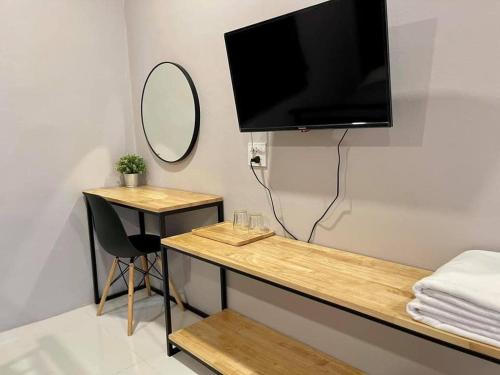 TV a/nebo společenská místnost v ubytování บ้าน ชลรพี Baan Chonrapee
