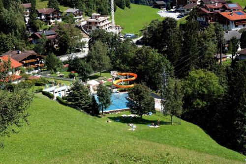 an aerial view of a water park with a slide at Roasnerhof in Finkenberg
